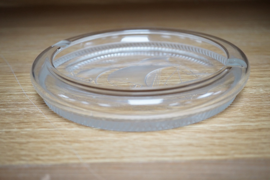 A modern Lalique ashtray decorated with a ship, signed to the base, 17cm in diameter. Condition - good